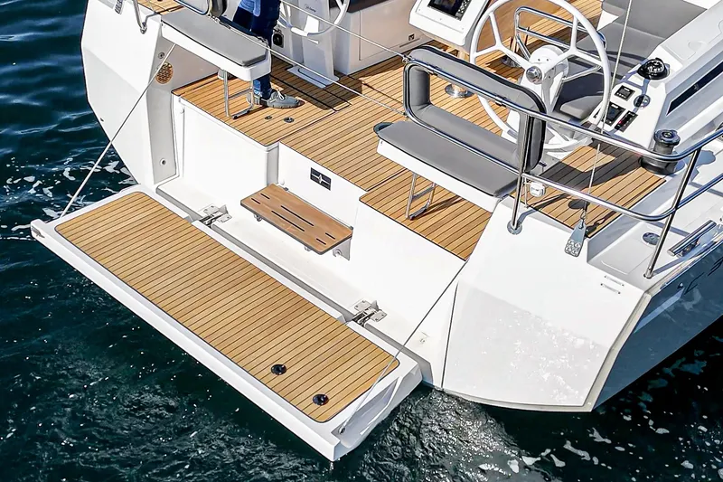 Slide: The Image of 2024 Bavaria C38 yacht with teak deck, featuring a spacious swim platform. - 28