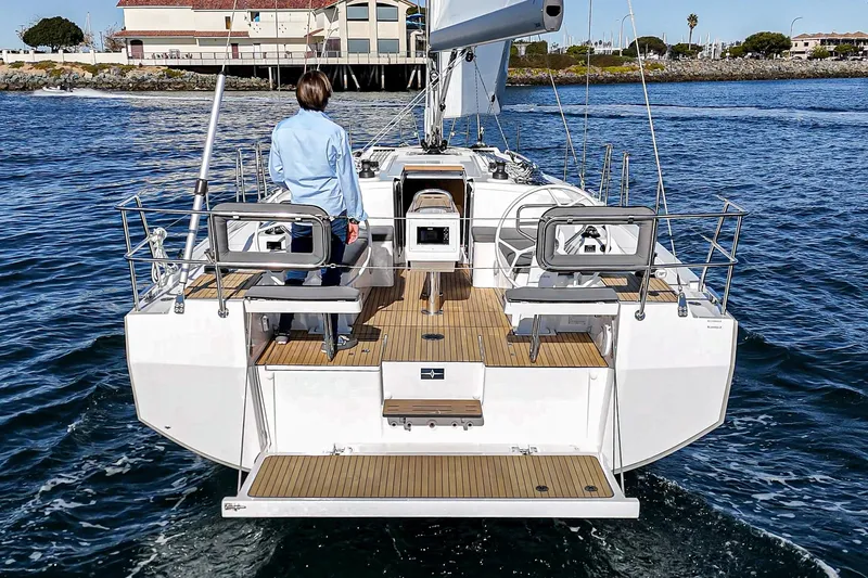 Slide: The Image of 2024 Bavaria C38 yacht sailing on calm waters, featuring a spacious deck and modern design. - 29