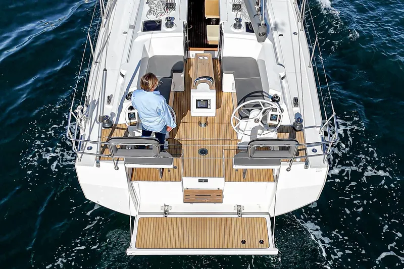 Slide: The Image of 2024 Bavaria C38 yacht, aerial view of deck and helm, sailing on open water. - 31