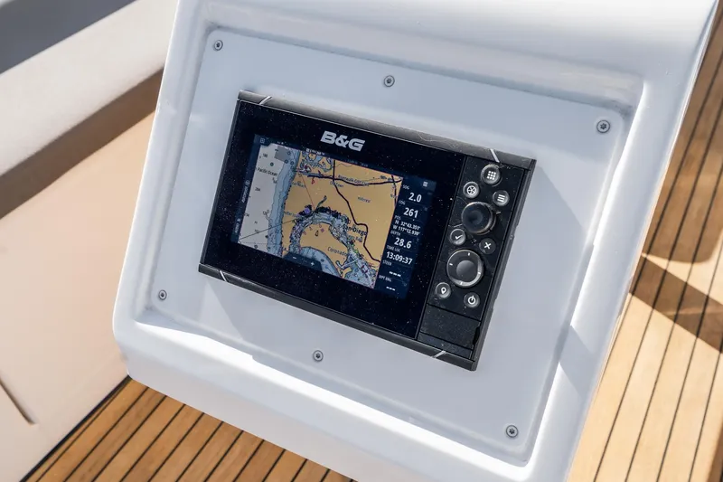 Slide: The Image of Bavaria C38 2024 yacht navigation system with B&G display on wooden deck. - 36