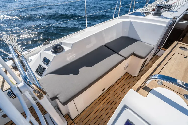 Slide: The Image of 2024 Bavaria C38 yacht cockpit with cushioned seating and teak flooring. - 38