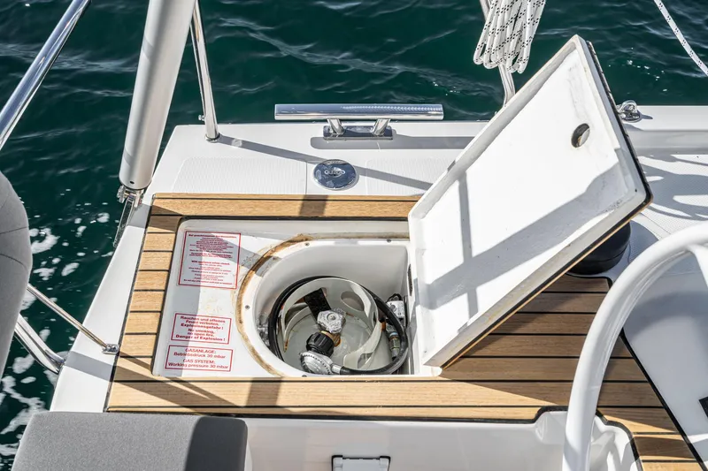 Slide: The Image of 2024 Bavaria C38 yacht deck with open storage compartment, showcasing sleek design and functionality. - 45