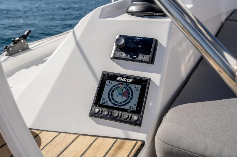 Slide: The Image of 2024 Bavaria C38 yacht cockpit with navigation instruments and teak flooring. - 46