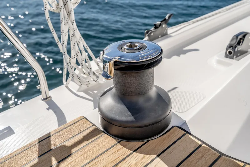Slide: The Image of 2024 Bavaria C38 yacht deck with winch and ropes, sailing on blue water. - 47