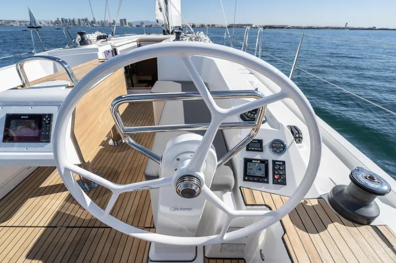 Slide: The Image of 2024 Bavaria C38 yacht helm with modern controls and ocean view. - 49