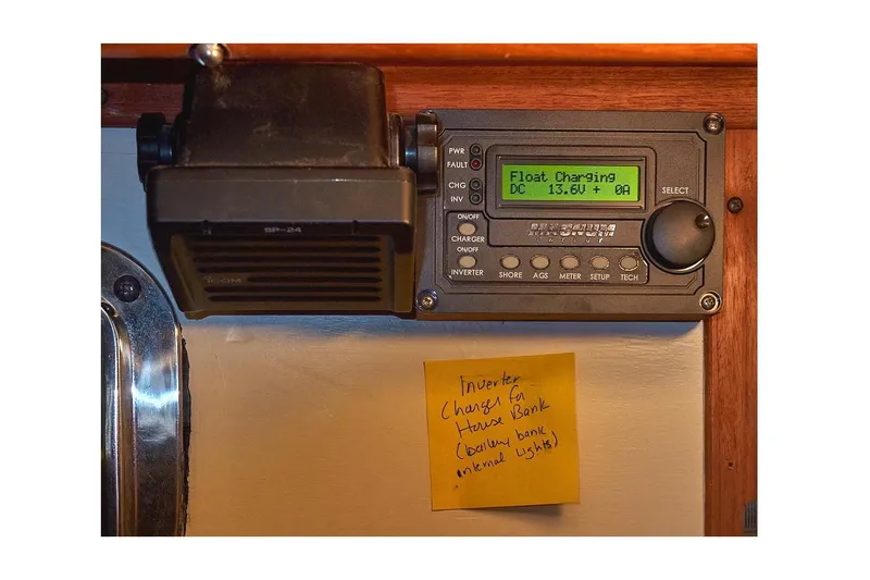 Slide: The Image of Control panel and speaker on 1983 Valiant 40 Selah boat with sticky note instructions. - 15