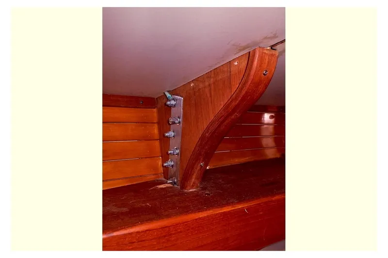 Slide: The Image of 1983 Valiant 40 Selah interior woodwork detail with metal bolts. - 16