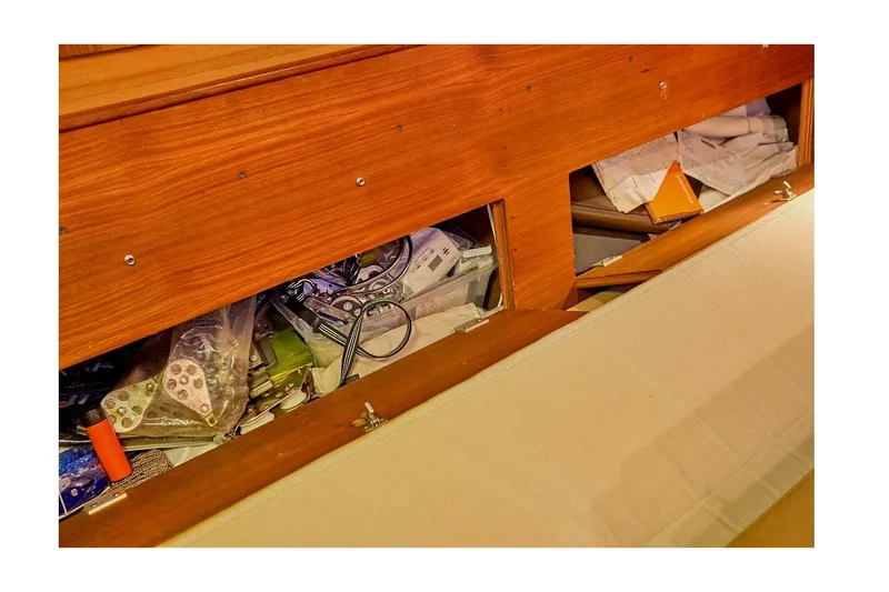 Slide: The Image of Storage compartment in 1983 Valiant 40 Selah yacht, filled with various items and equipment. - 20