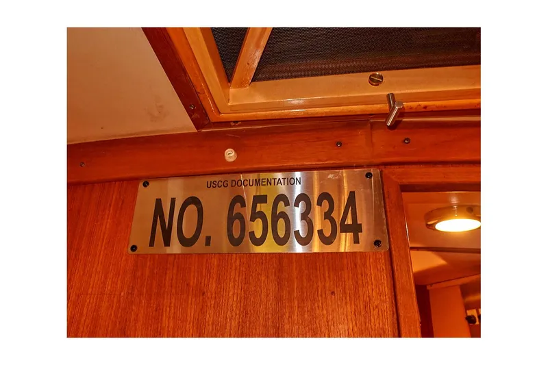Slide: The Image of USCG documentation plaque on 1983 Valiant 40 Selah boat, number 656334. - 23
