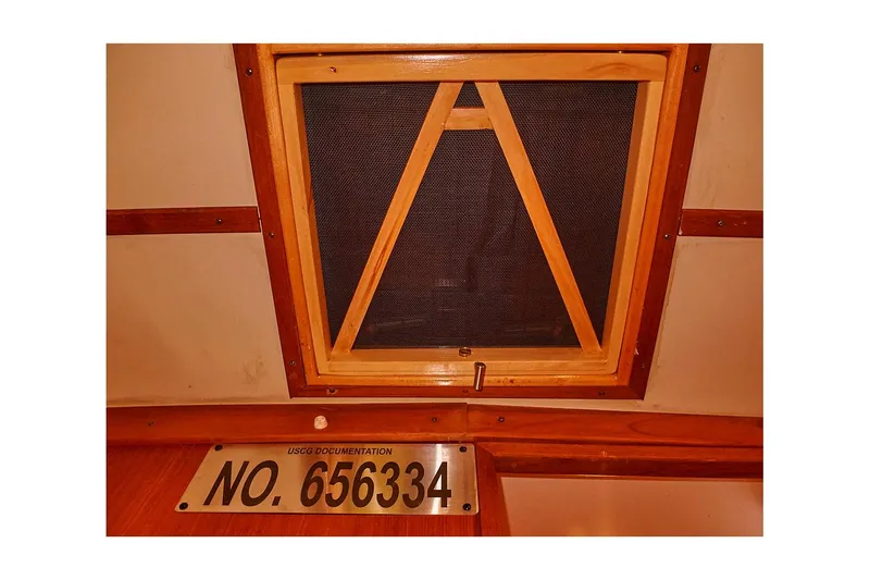Slide: The Image of Wooden hatch and documentation number on 1983 Valiant 40 Selah boat interior. - 24