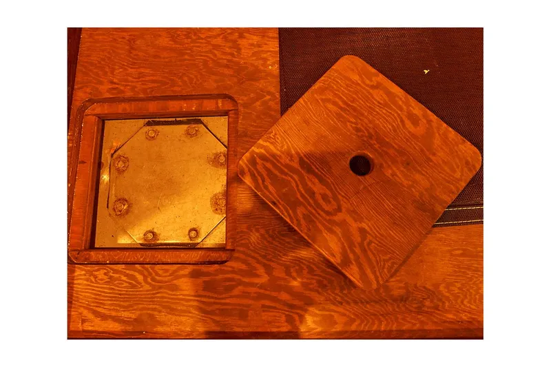 Slide: The Image of Wooden hatch cover and metal plate on 1983 Valiant 40 Selah boat. - 26