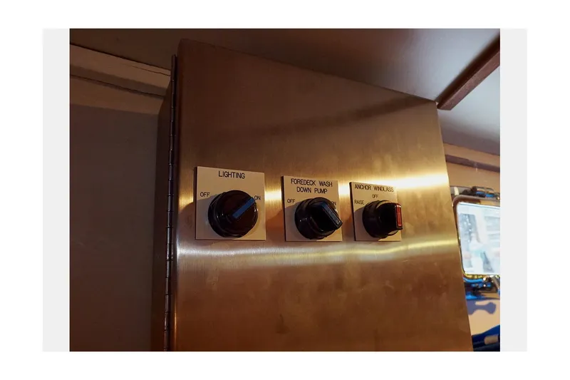 Slide: The Image of Control panel with switches for lighting, pump, and window on 1983 Valiant 40 Selah. - 41