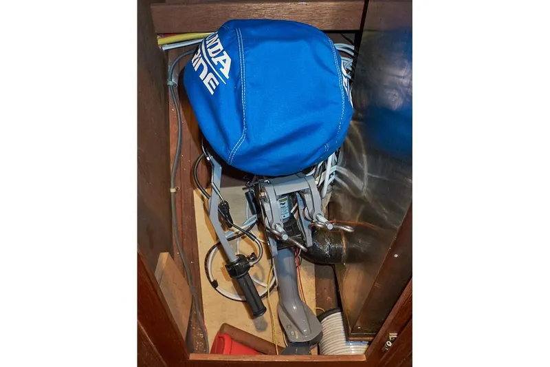Slide: The Image of Storage compartment on 1983 Valiant 40 Selah yacht with blue cover and equipment. - 43
