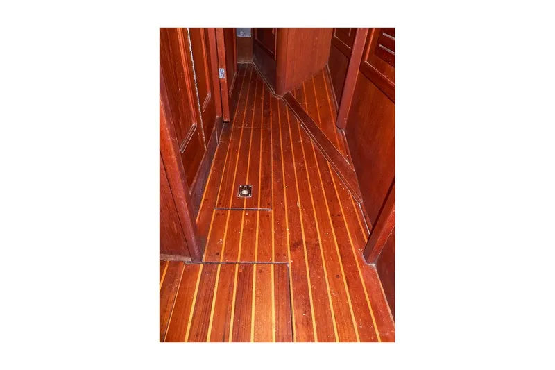 Slide: The Image of 1983 Valiant 40 Selah yacht interior with polished wooden flooring. - 44