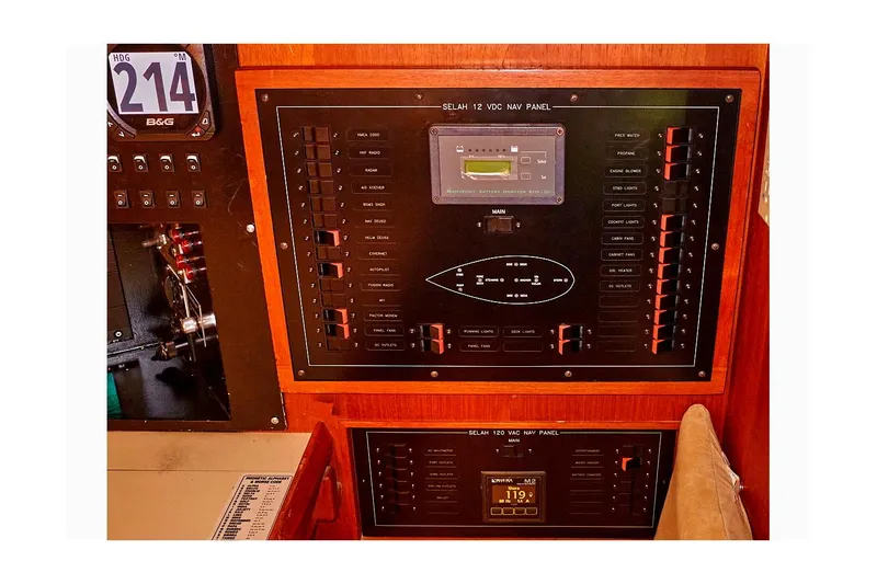 Slide: The Image of Electrical panel of 1983 Valiant 40 Selah sailboat, featuring switches and controls. - 49