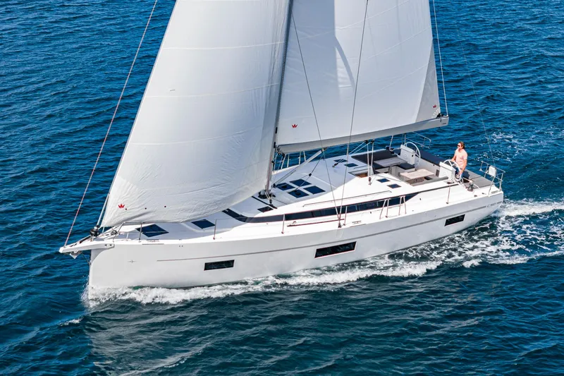 Slide: The Image of 2024 Bavaria C50 sailing yacht cruising on open water. - 5