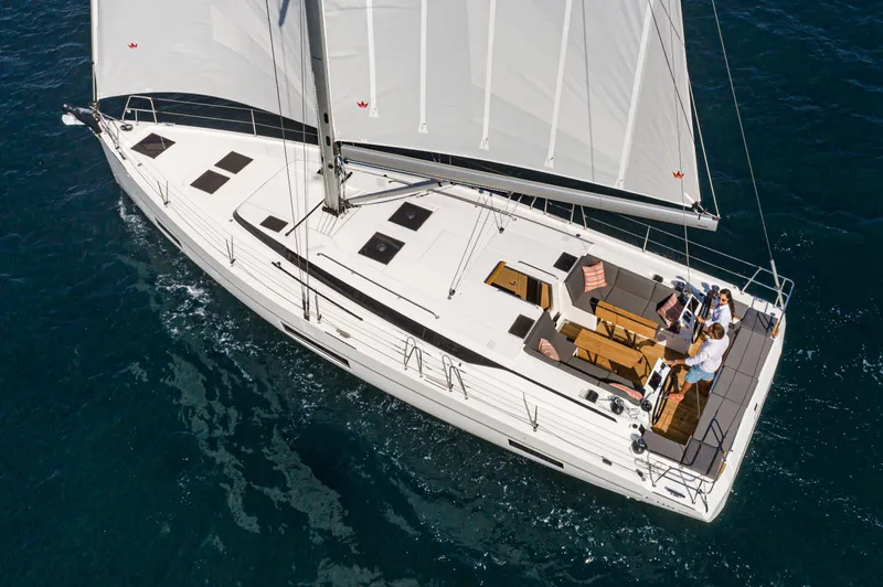 Slide: The Image of 2024 Bavaria C45 yacht sailing on open water, featuring spacious deck and modern design. - 11
