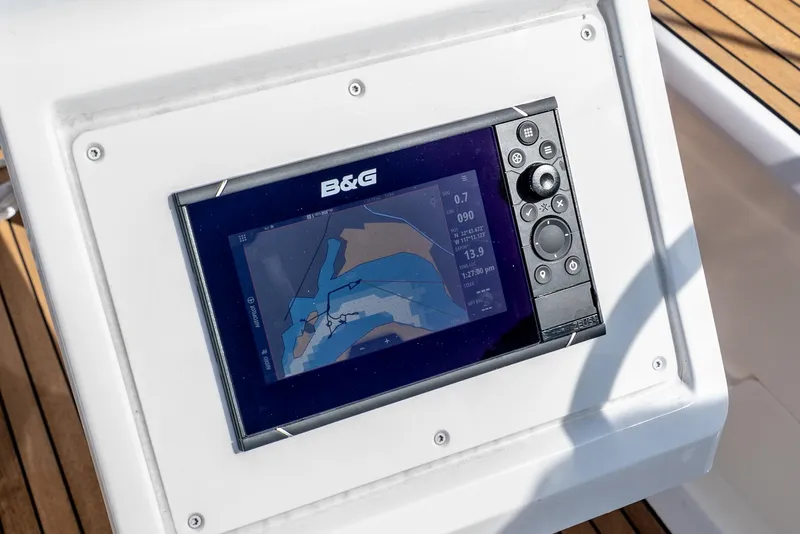 Slide: The Image of Bavaria Cruiser 34 2024 navigation system with B&G display on wooden deck. - 16