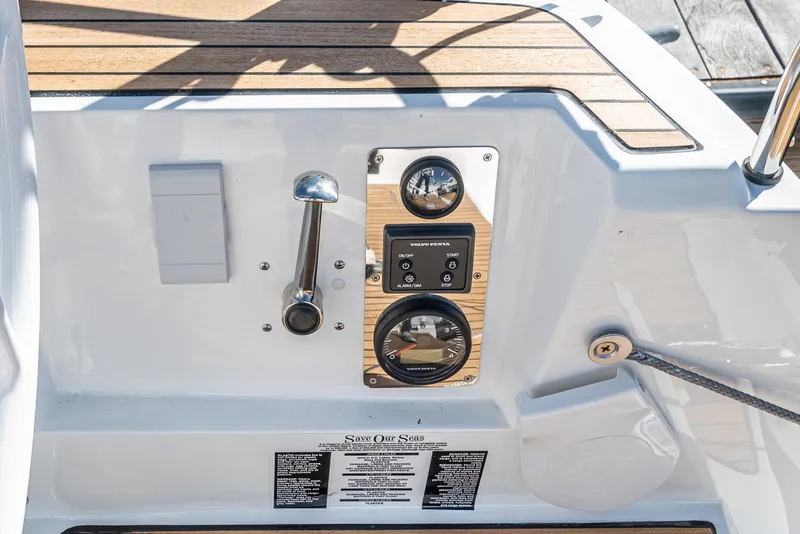 Slide: The Image of Control panel of 2024 Bavaria Cruiser 34 sailboat with wooden accents. - 19