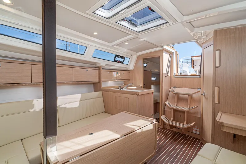 Slide: The Image of 2024 Bavaria Cruiser 34 interior with modern wood finish and ample natural light. - 29