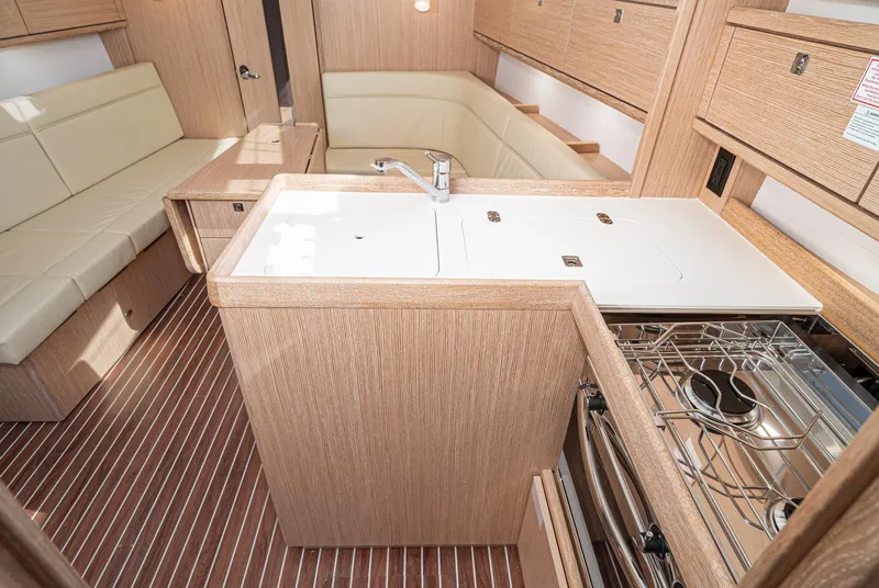 Slide: The Image of 2024 Bavaria Cruiser 34 interior with modern kitchen and seating area. - 32