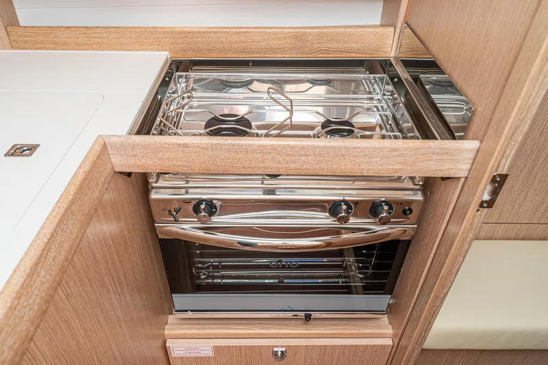 Slide: The Image of Modern kitchen stove in 2024 Bavaria Cruiser 34 yacht interior. - 35