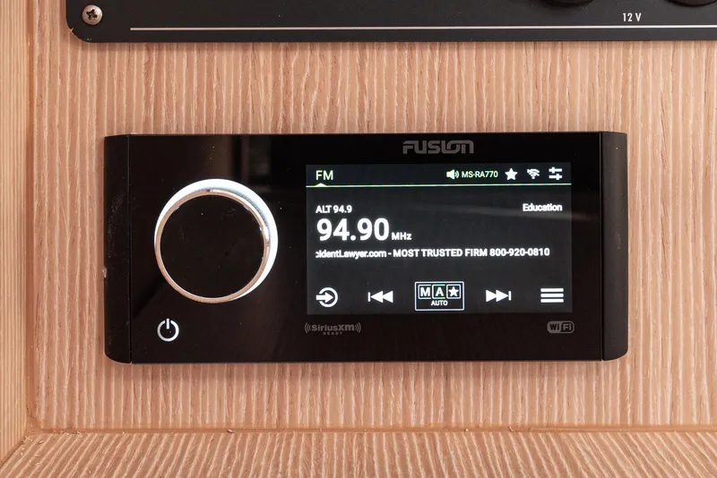 Slide: The Image of Fusion radio display on 2024 Bavaria Cruiser 34 yacht, tuned to 94.9 FM. - 38