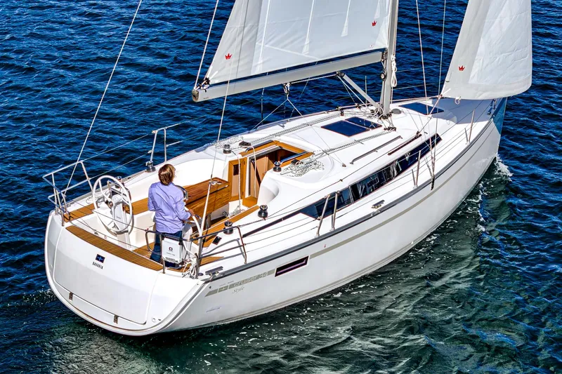Slide: The Image of 2024 Bavaria Cruiser 34 sailing on open water, featuring sleek design and spacious deck. - 5