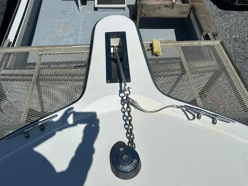 Slide: The Image of Bow of 2002 Albemarle 410 Express Fisherman with anchor chain and winch. - 36
