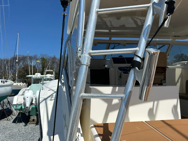 Slide: The Image of 2002 Albemarle 410 Express Fisherman boat with ladder and cockpit view. - 38