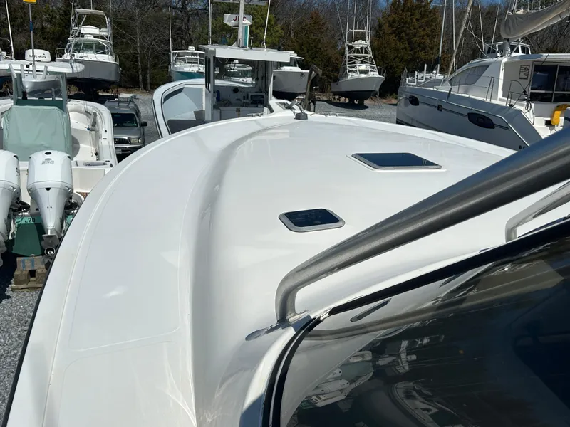 Slide: The Image of 2002 Albemarle 410 Express Fisherman boat deck with sleek design and multiple hatches. - 39