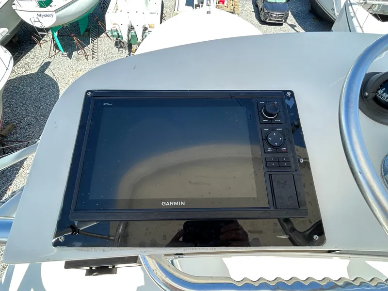 Slide: The Image of Garmin navigation system on 2002 Albemarle 410 Express Fisherman boat dashboard. - 44
