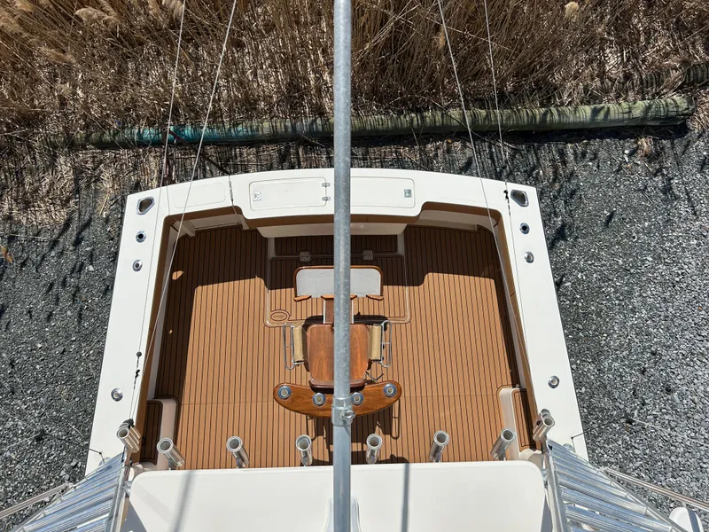 Slide: The Image of Overhead view of 2002 Albemarle 410 Express Fisherman boat deck with wooden flooring. - 47