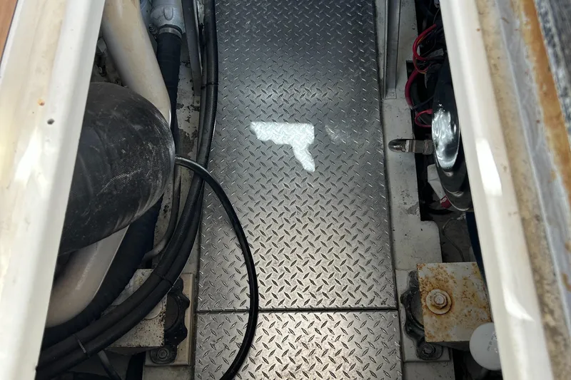 Slide: The Image of Engine compartment of a 2002 Albemarle 410 Express Fisherman with diamond plate flooring. - 48