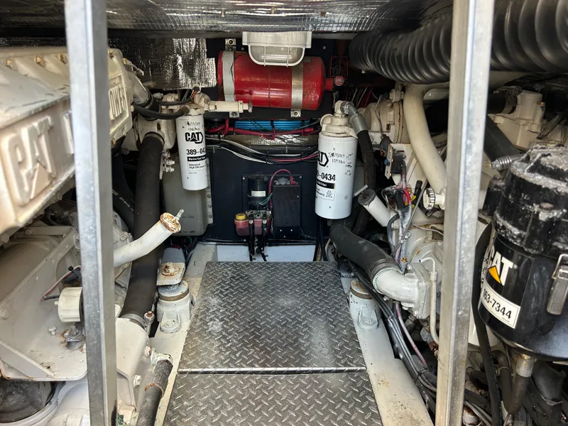 Slide: The Image of Engine room of a 2002 Albemarle 410 Express Fisherman with CAT machinery and components. - 49