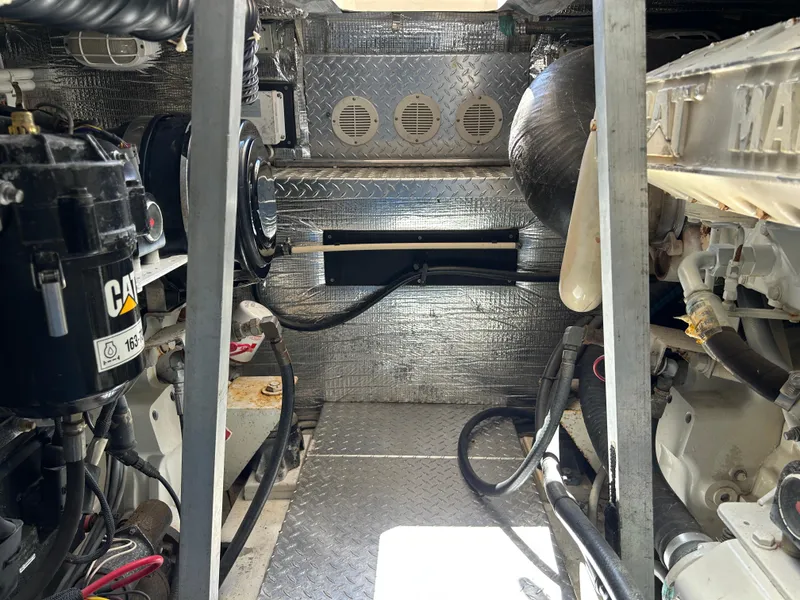Slide: The Image of Engine room of 2002 Albemarle 410 Express Fisherman with visible machinery and components. - 50