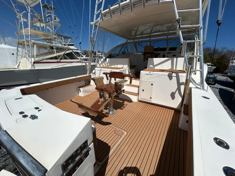 Slide: The Image of 2002 Albemarle 410 Express Fisherman boat with spacious deck and seating area. - 7