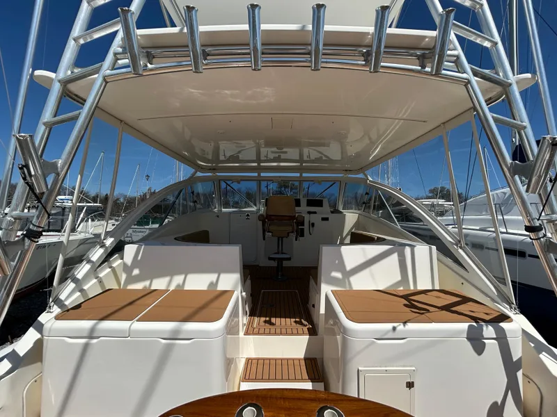Slide: The Image of 2002 Albemarle 410 Express Fisherman boat interior with seating and helm station. - 9
