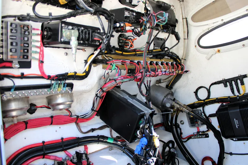 Slide: The Image of Intricate wiring and components inside a 2020 Release 240 RX boat. - 15