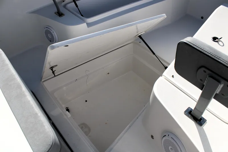 Slide: The Image of Open storage compartment on 2020 Release 240 RX boat interior. - 20
