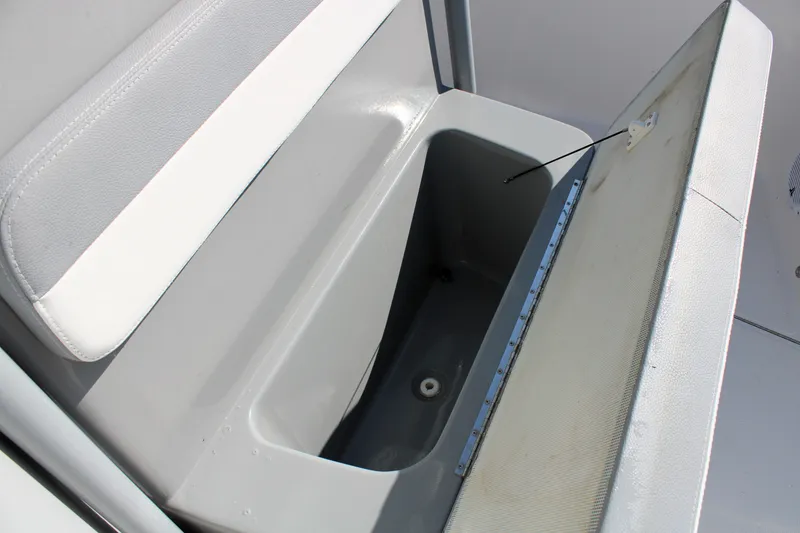 Slide: The Image of Open storage compartment in 2020 Release 240 RX boat. - 21
