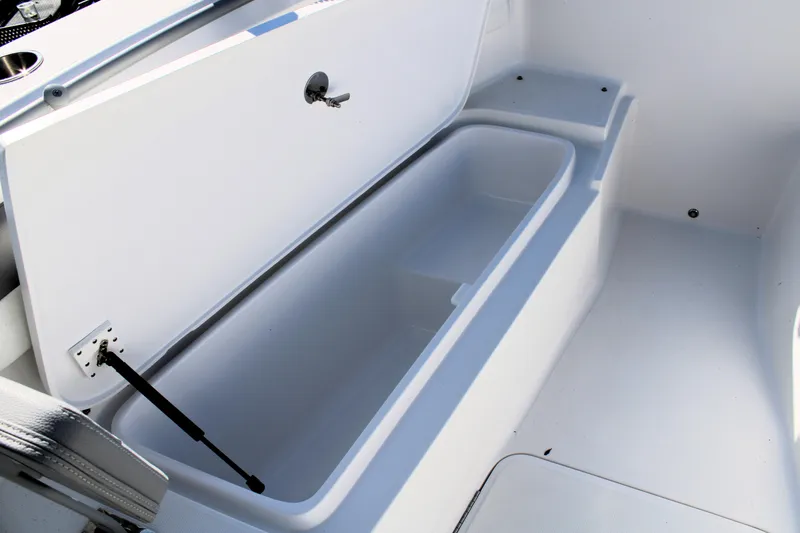 Slide: The Image of Open storage compartment in 2020 Release 240 RX boat. - 22