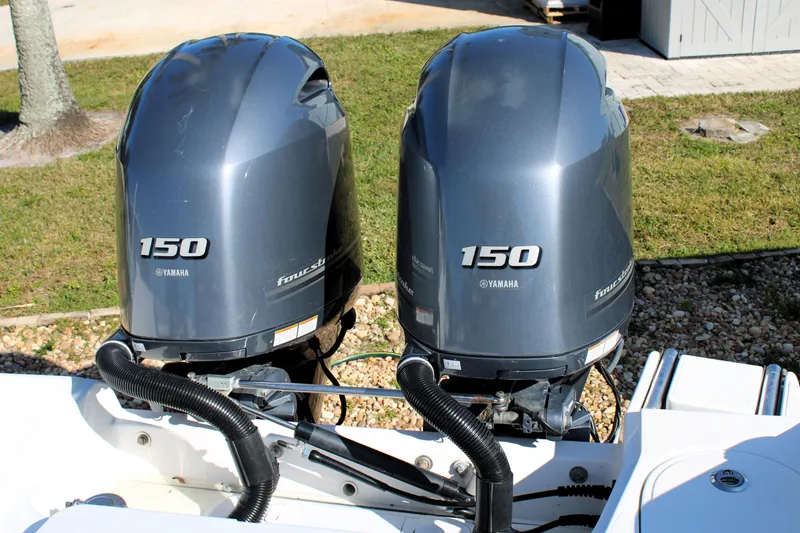 Slide: The Image of Twin Yamaha 150 outboard motors on a 2020 Release 240 RX boat. - 27
