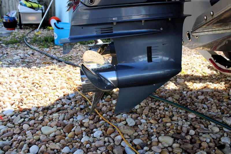 Slide: The Image of Close-up of a 2020 Release 240 RX boat propeller on a rocky surface. - 29