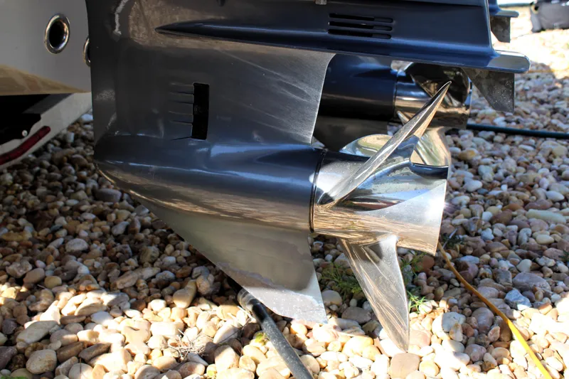 Slide: The Image of Close-up of a 2020 Release 240 RX boat propeller on rocky ground. - 30