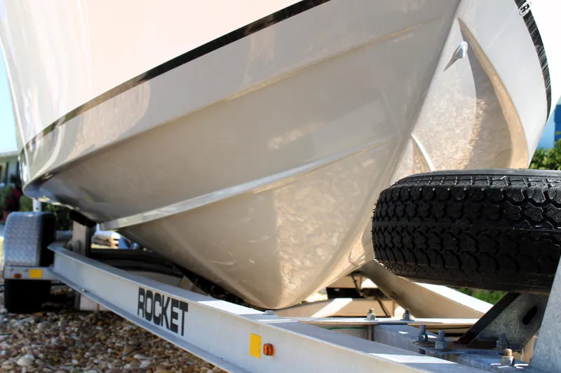 Slide: The Image of 2020 Release 240 RX boat on Rocket trailer, close-up view. - 32