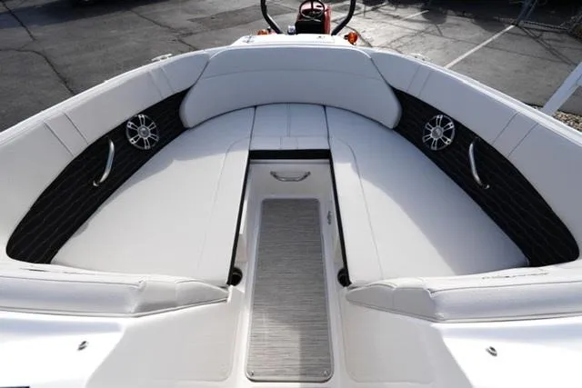 Slide: The Image of 2025 Sea Ray SPX 230 boat interior with white seating and sleek design. - 7