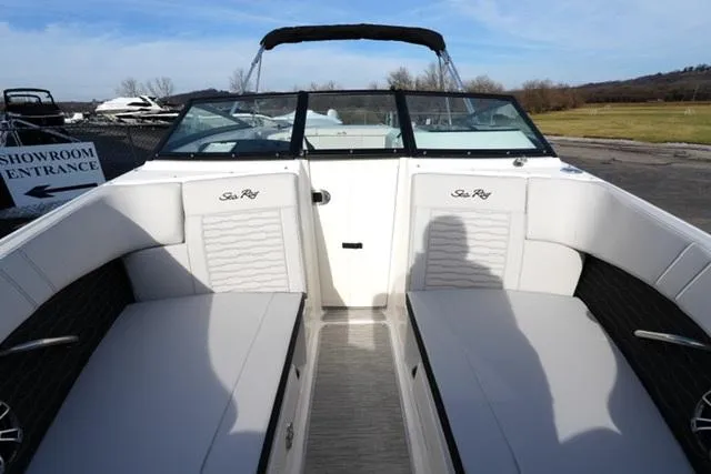 Slide: The Image of 2025 Sea Ray SPX 230 boat interior with white seating and open deck view. - 8