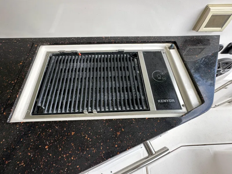 Slide: The Image of Built-in Kenyon grill on 2014 Regal 35 Sport Coupe yacht's countertop. - 17