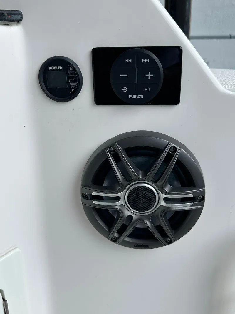 Slide: The Image of Control panel and speaker on 2014 Regal 35 Sport Coupe boat. - 18